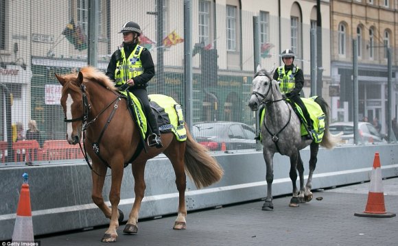 Mounted police officers patrol
