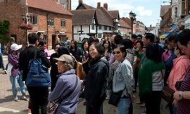 Chinese tourists see Stratford-upon-Avon.