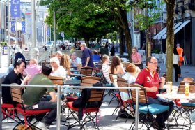 folks enjoying the May sun on Mill Lane