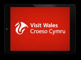 Visit Wales logo white on red